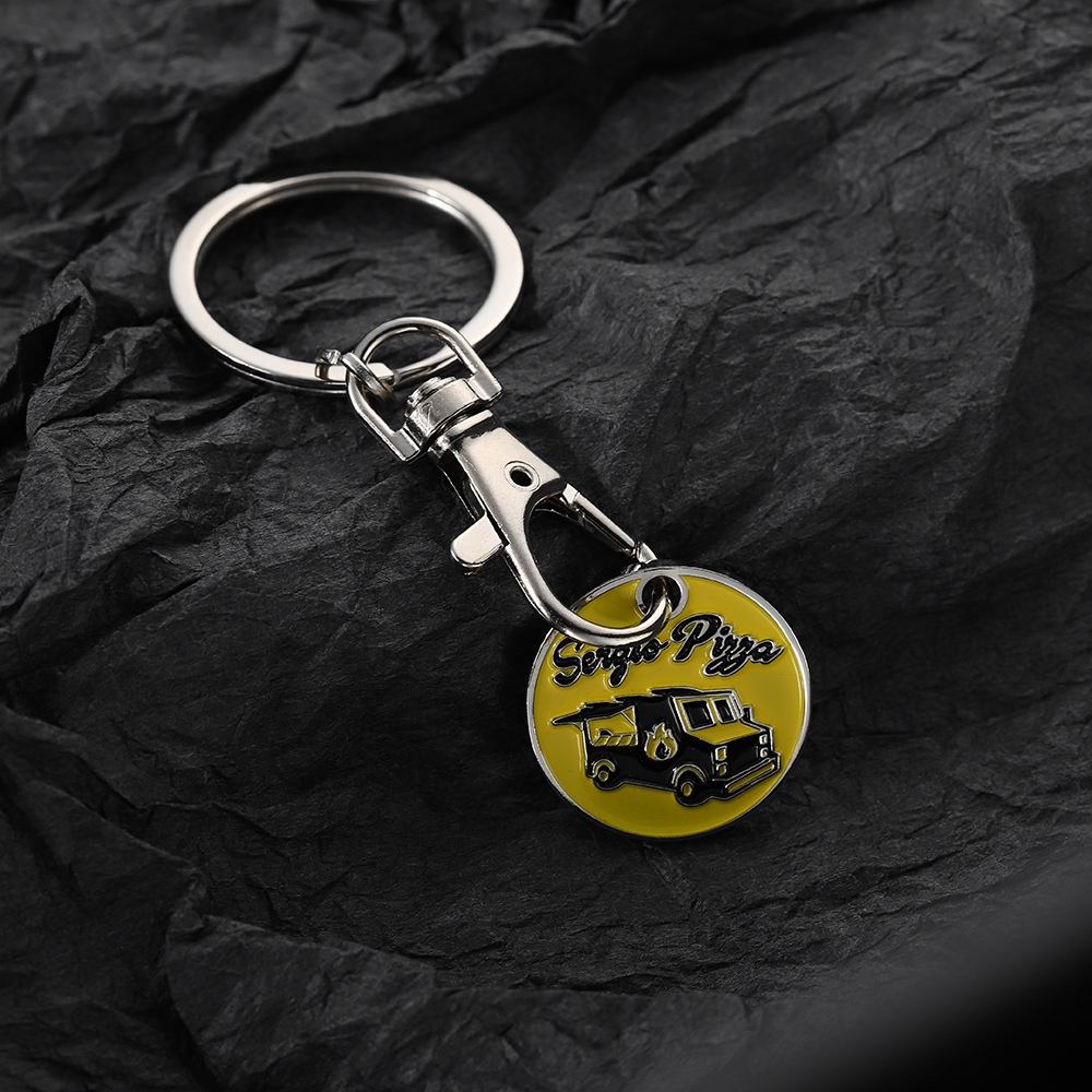 Pièce de monnaie de chariot de keychain d'achats