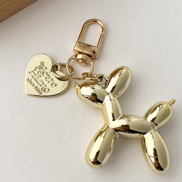 Cachorro dorado + corazón dorado