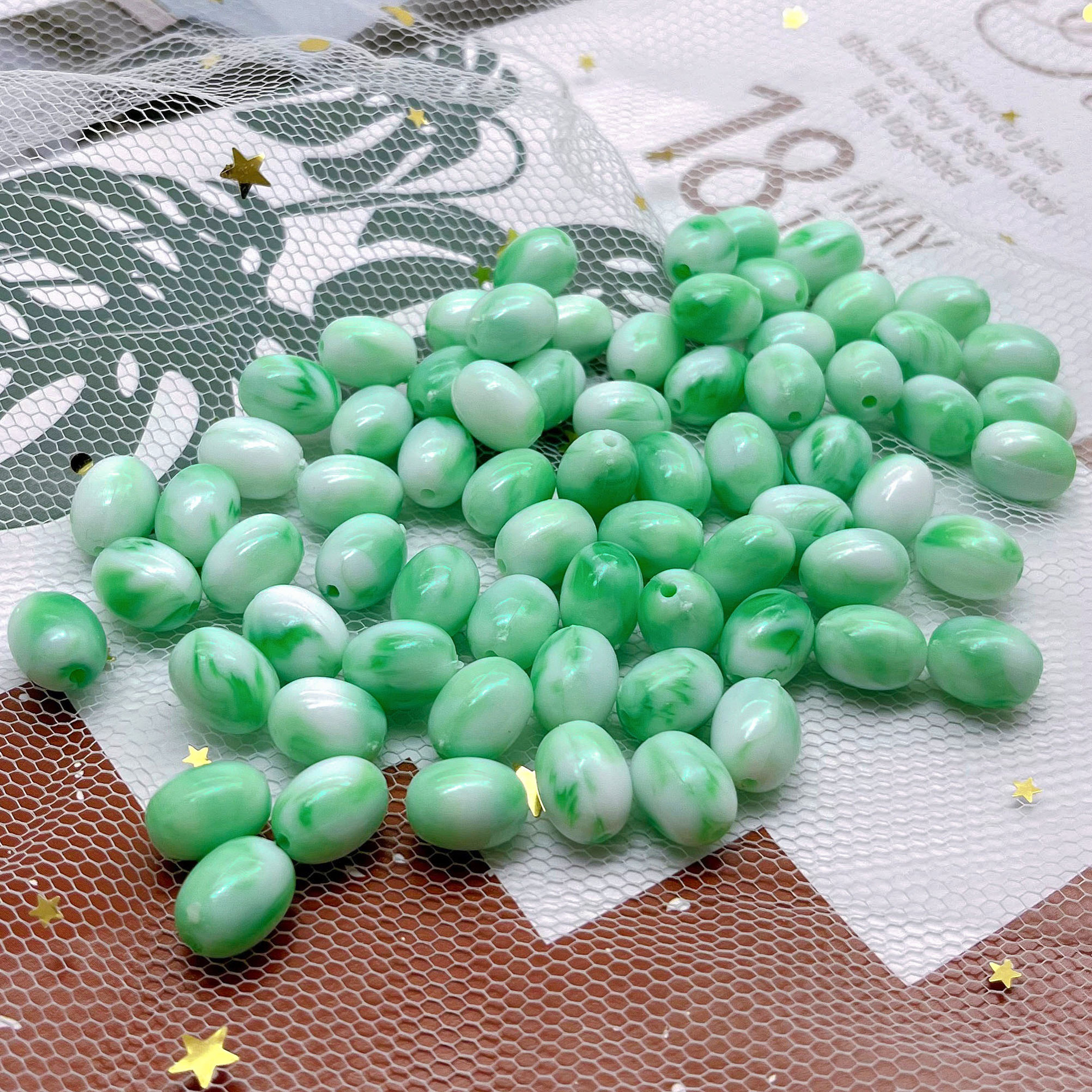 Perles ovales bicolores macaron en vert