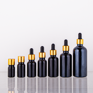 Venta al por mayor de fábrica 10ml 15ml 30ml 50ml 100mL botella de vidrio con gotas de aceite esencial negro brillante con tapa dorada botella vacía de suero - Product Image 1