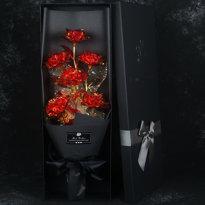 6 gold colored red flowers