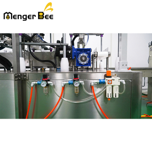 Macchina automatica per la lavorazione del miele con 4 ugelli di riempimento bottiglia di plastica capsula di miele in bottiglia