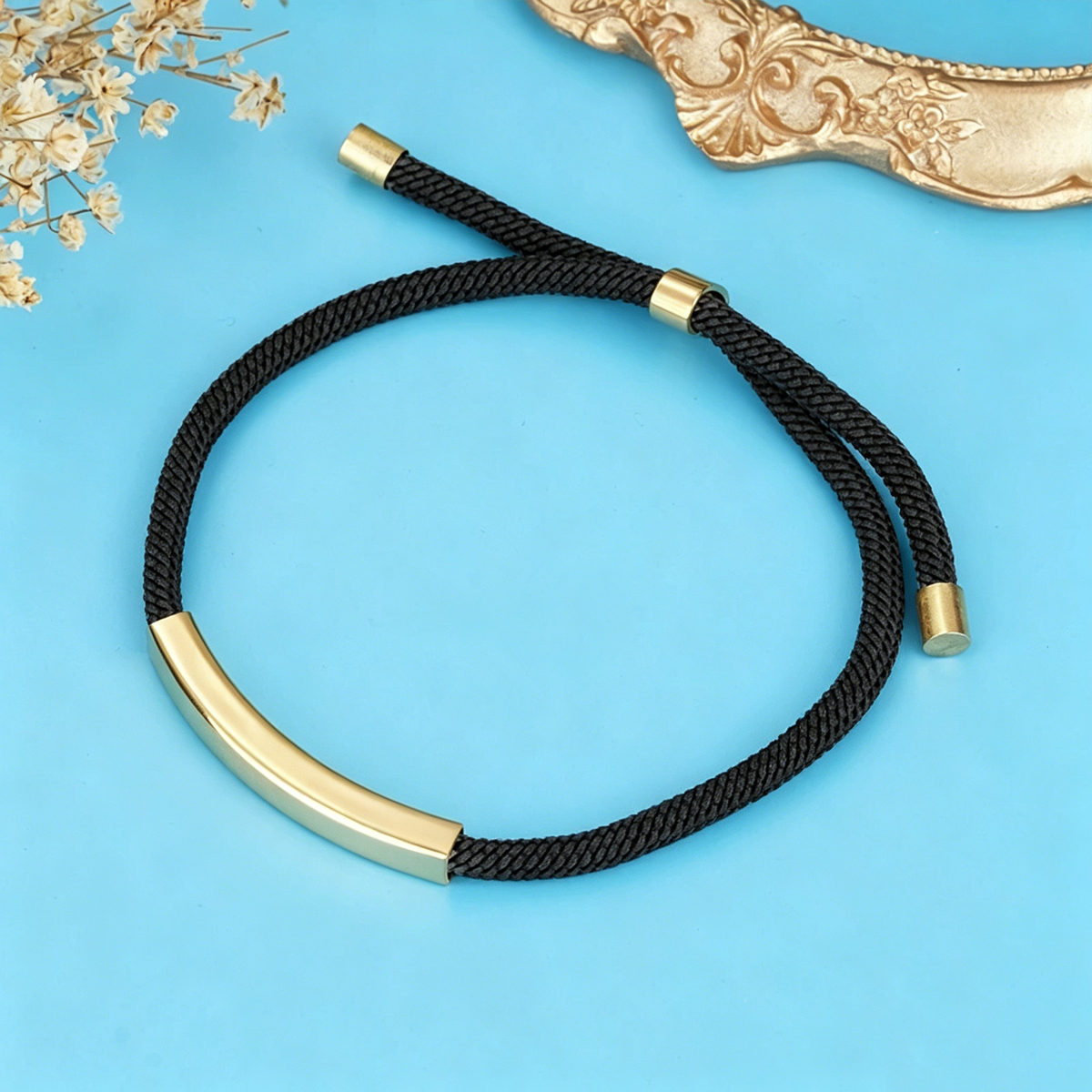 Ciondolo in oro + cordoncino nero