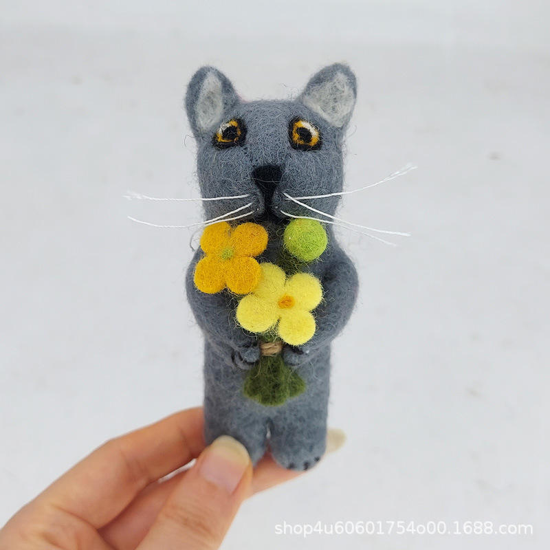 Blue cat holding a cauliflower