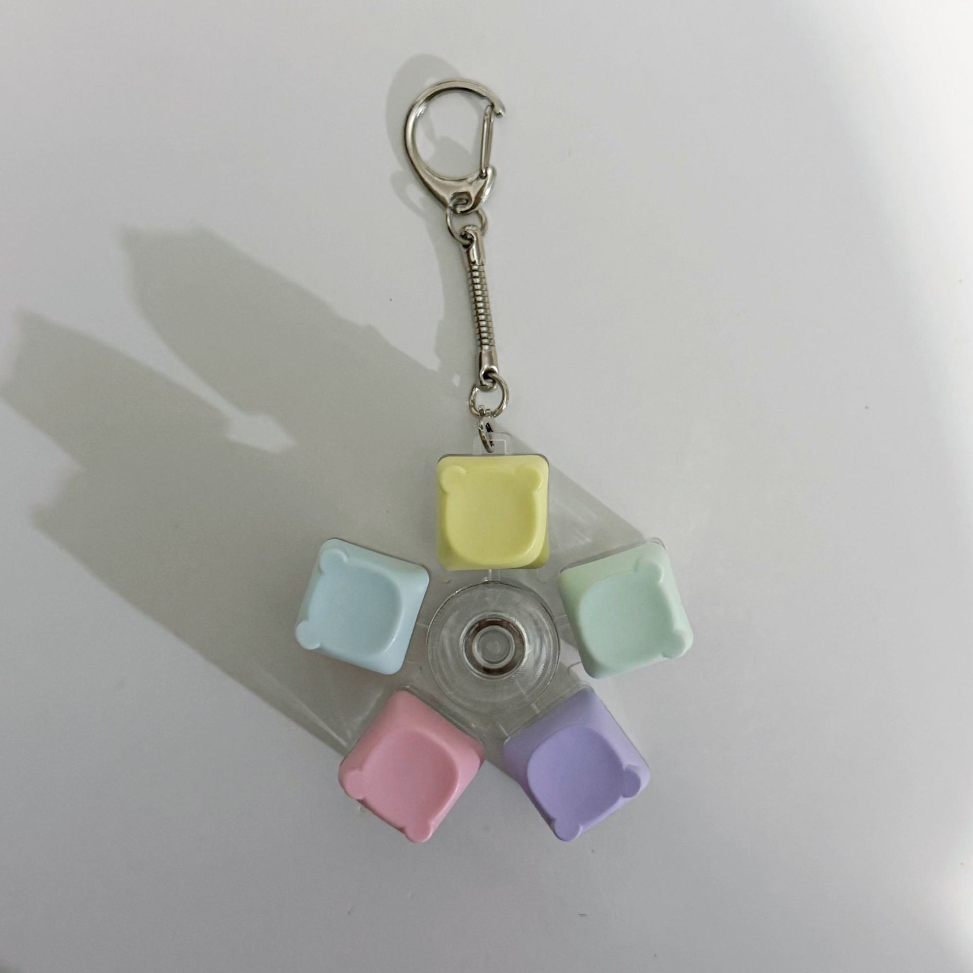 Colorful rotating button keychain with bear head