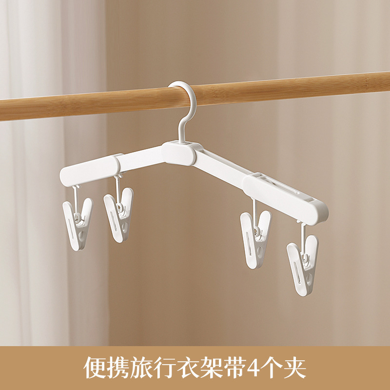 One clothes hanger with four clips