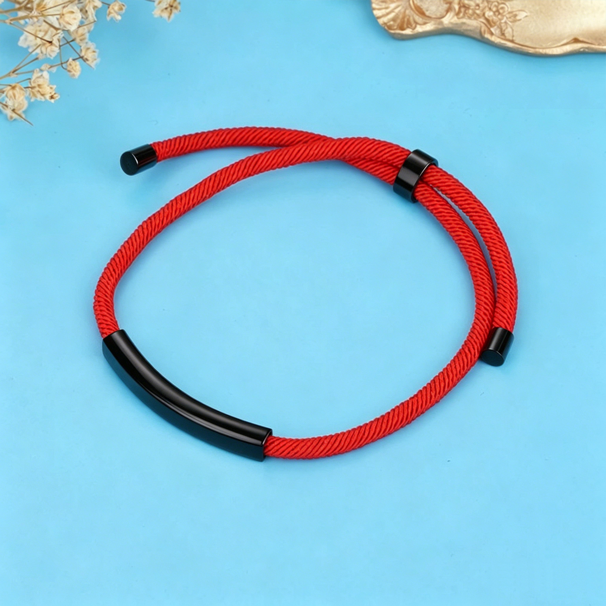 Ciondolo nero + cordoncino rosso