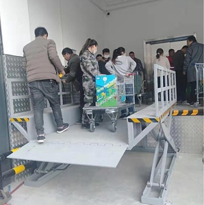 Precio de fábrica Contenedor Muelle Camión Plataforma de trabajo de carga y descarga Motor personalizado para motor de tijera móvil Mesa de motor