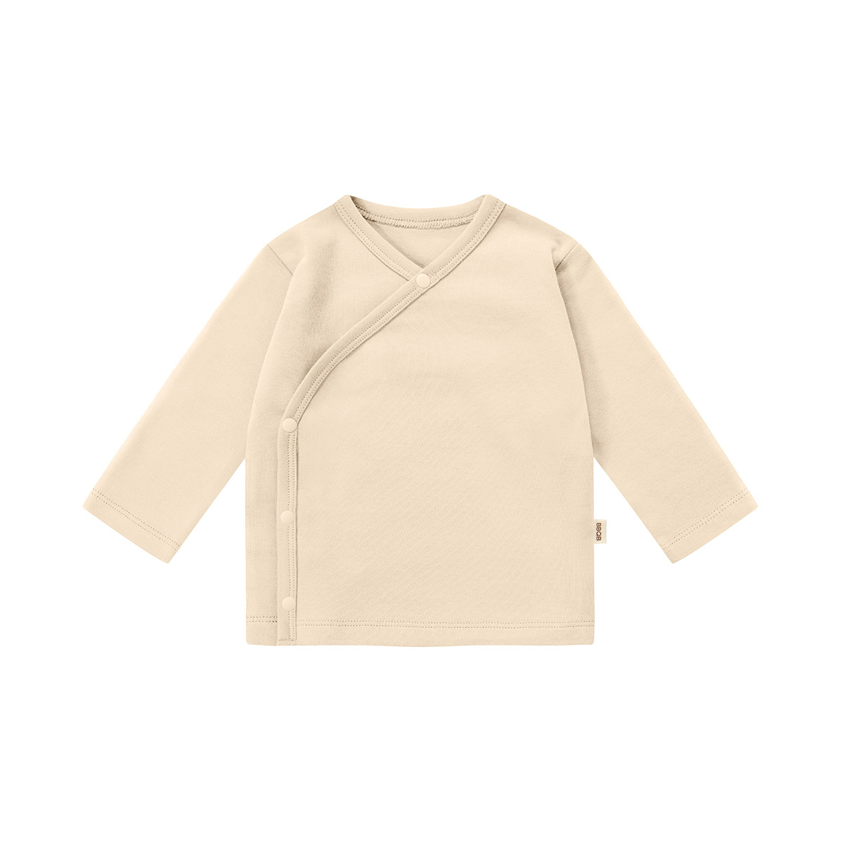 Top con bottoni color albicocca