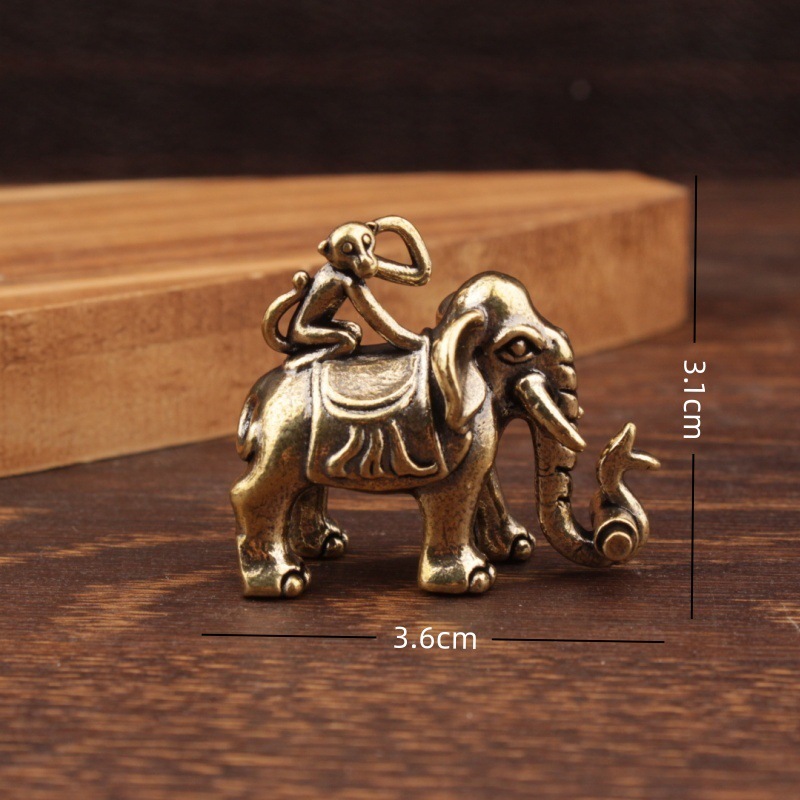 Monkey riding an elephant