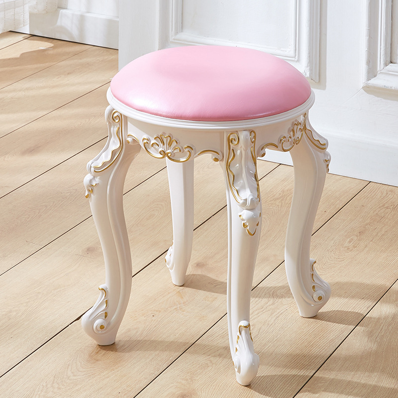 Tabouret rond en cuir rose avec bordure dorée, hauteur 43 cm