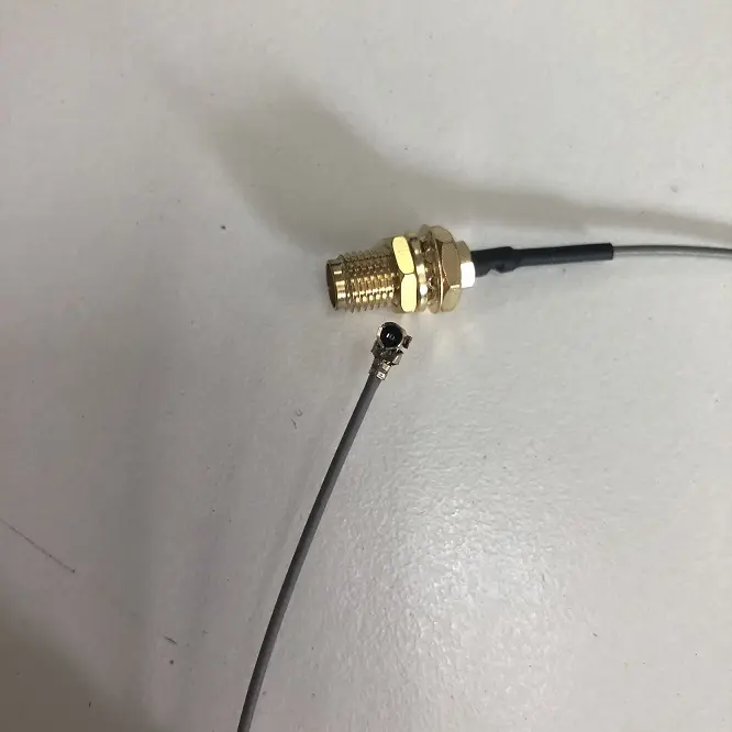 Gray 1.13mm RF Coaxial Adapter Cable with UF.L Brass Plug and Sealed SMA FEM. Bulkhead Mounted Connector