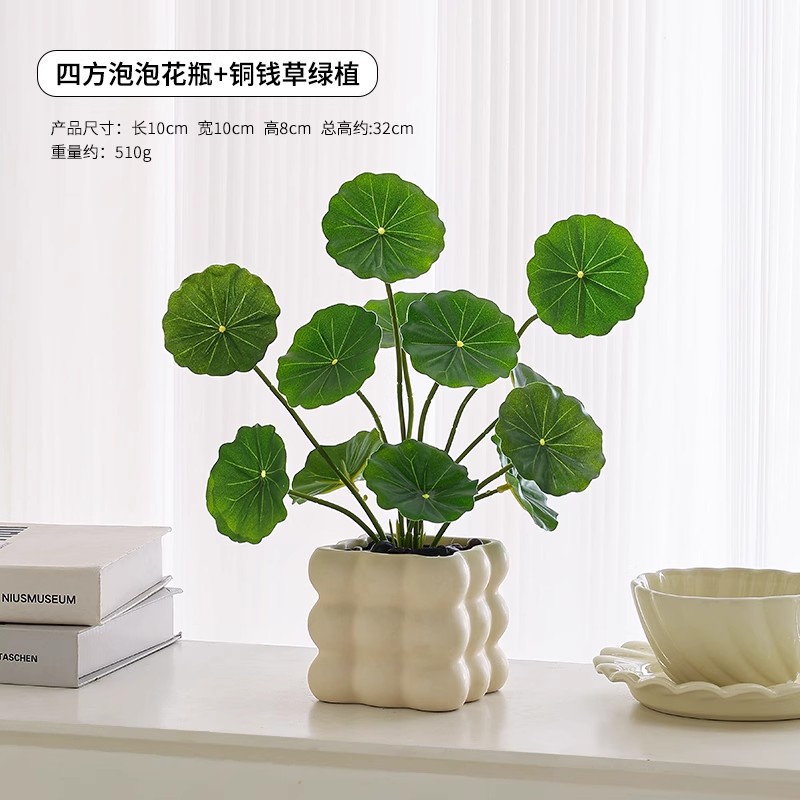 Vase à bulles avec feuilles de pièces