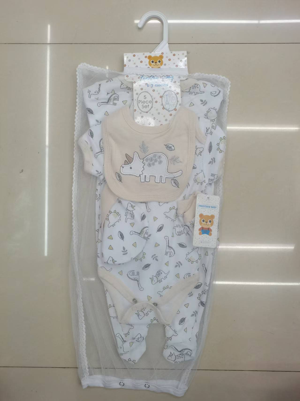 Piccolo dinosauro beige