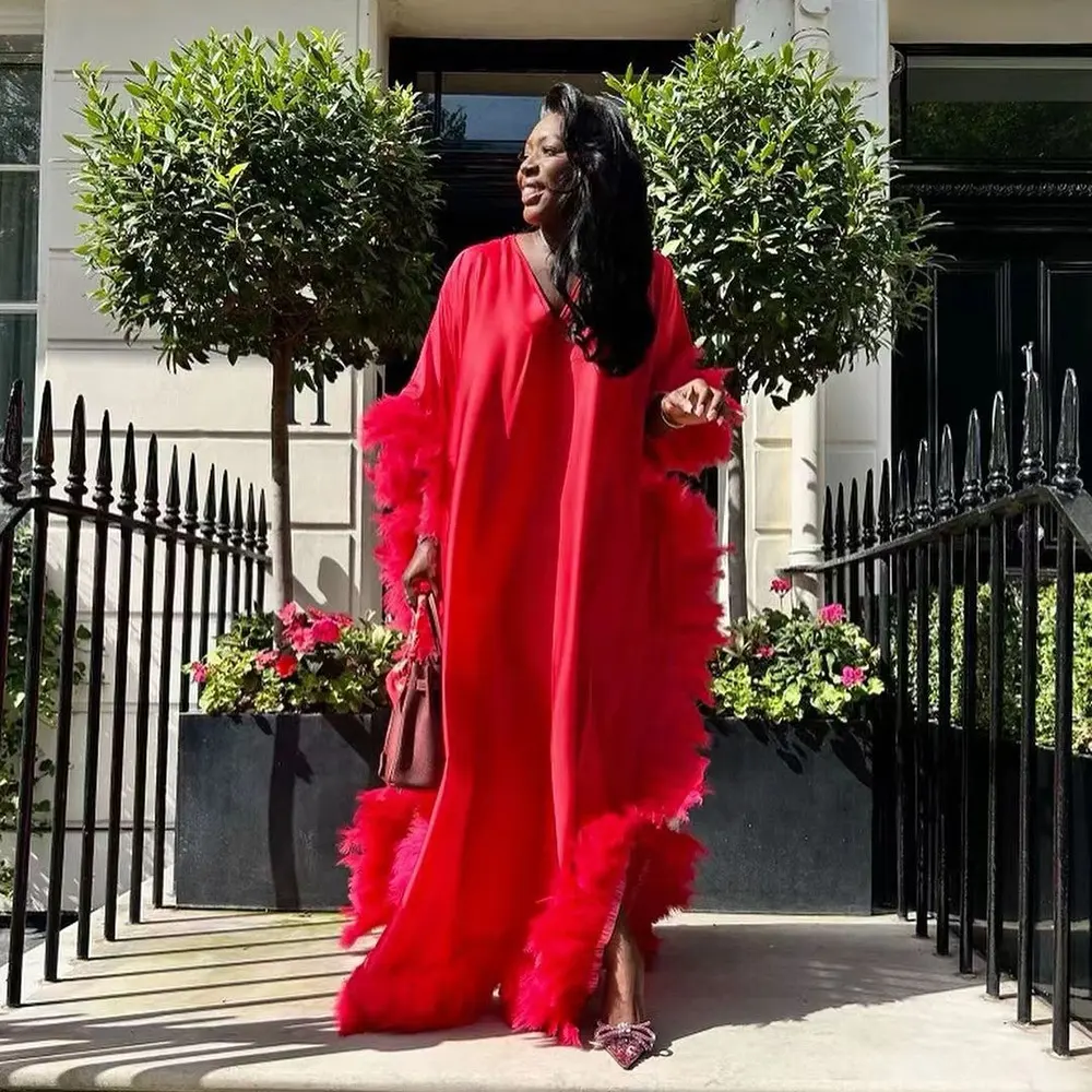 Fashion Africa's new luxury full enveloped plumed high slit gown dress