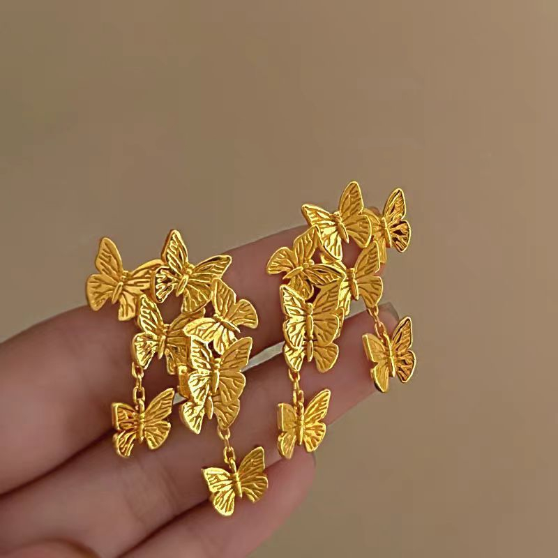Pendientes de arbusto de flores de mariposa dorada