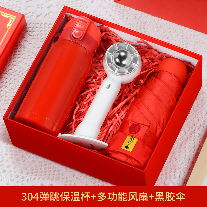Boîte cadeau parapluie double usage avec gourde isotherme gonflable rouge.