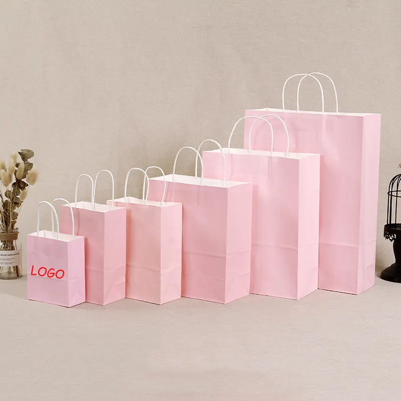 Maniglia del sacchetto della spesa della carta Kraft rosa del mestiere d'imballaggio su ordinazione all'ingrosso con i vostri sacchetti della spesa di carta di logo