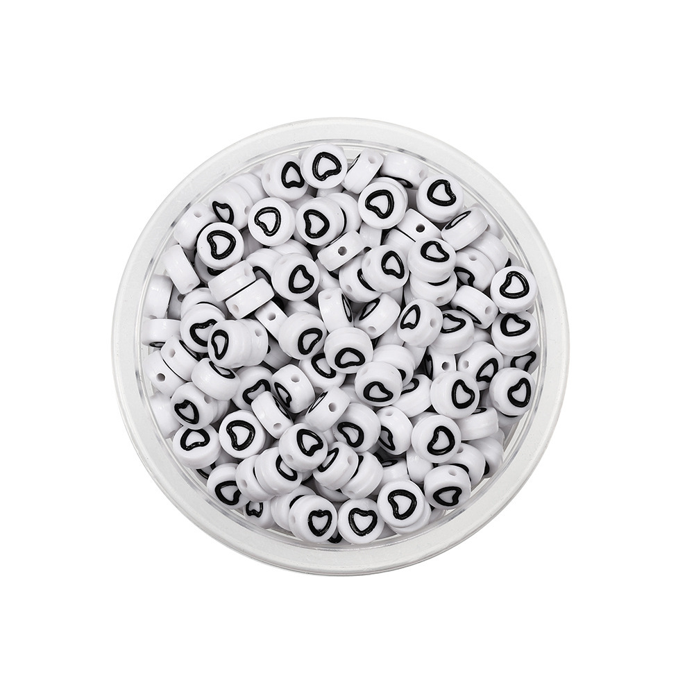 Perles creuses rondes blanches et noires