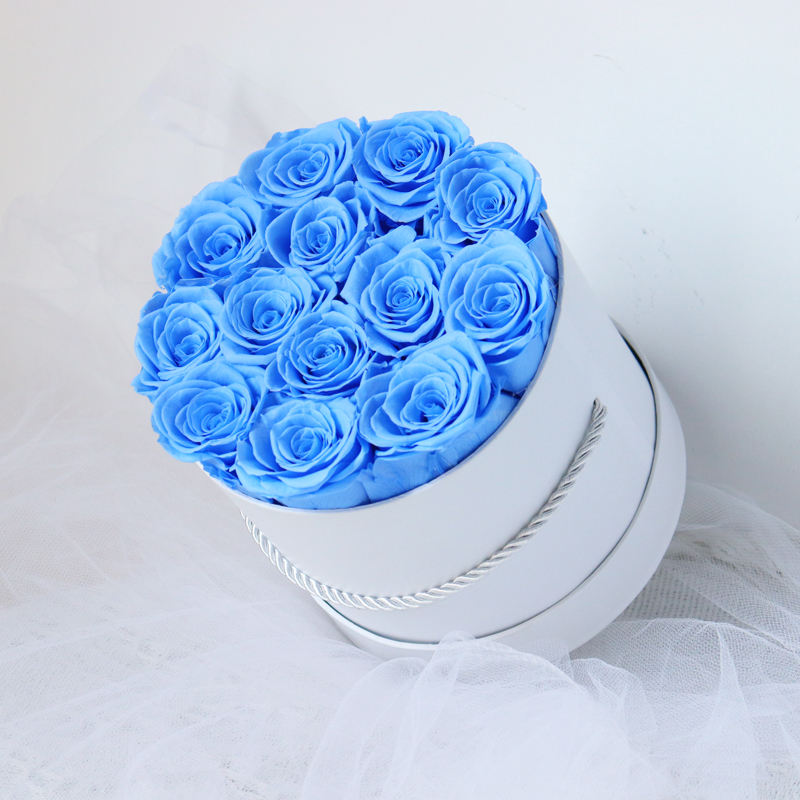 Rose éternelle dans une boîte ronde