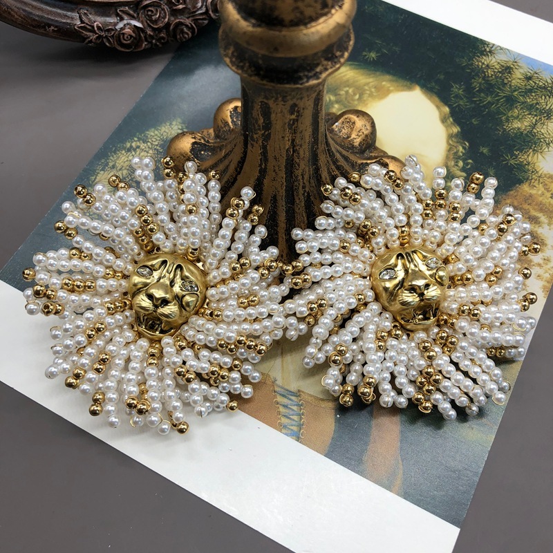 Gold lion ear clip