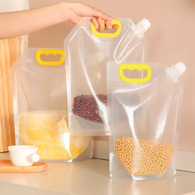 Embalaje de bebidas de plástico de grado alimenticio de fábrica 1L 3L 5L Bolsas transparentes de pie para bebidas transparentes Bolsa con boquilla para granos