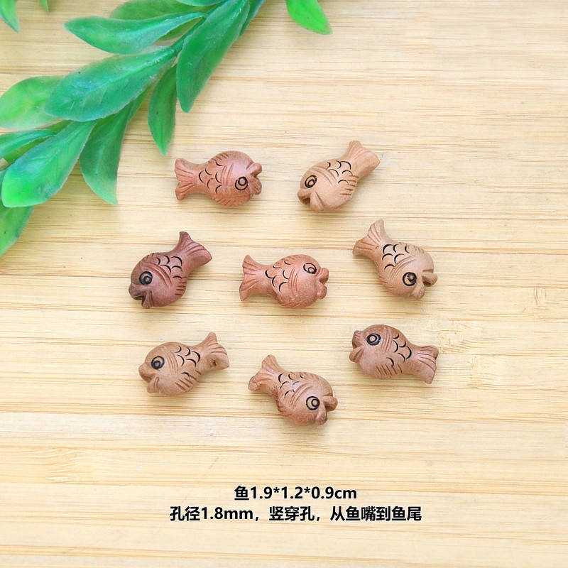 Peach wood fish pendant
