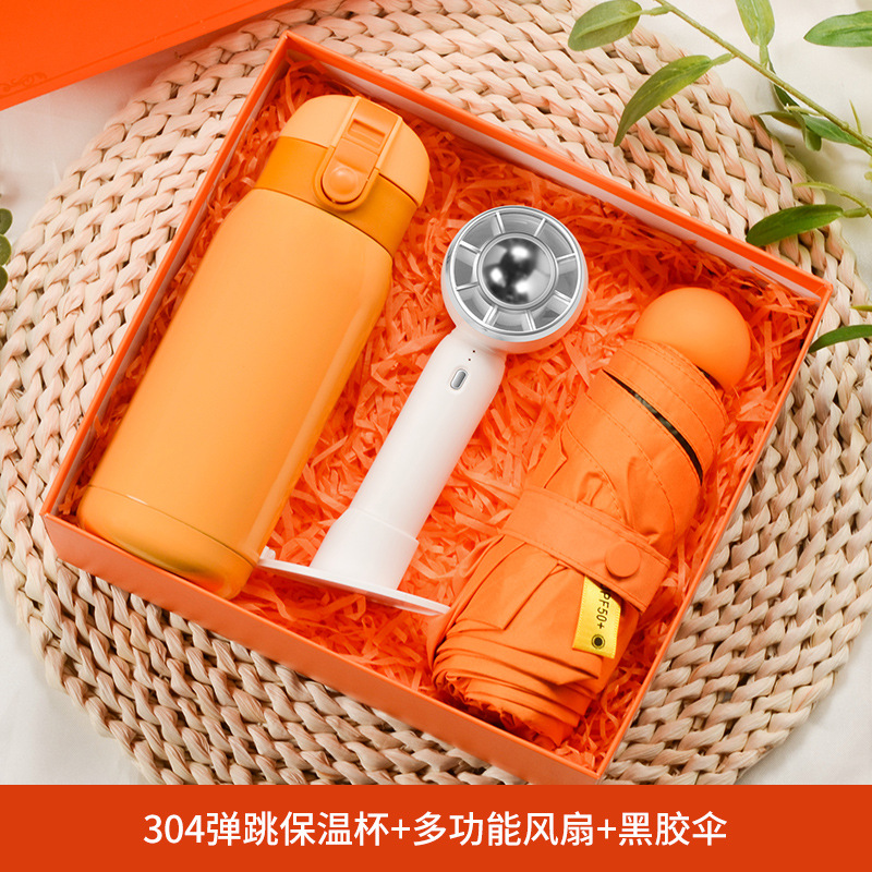 Boîte cadeau parapluie éventail Vortex avec tasse rebondissante orange.