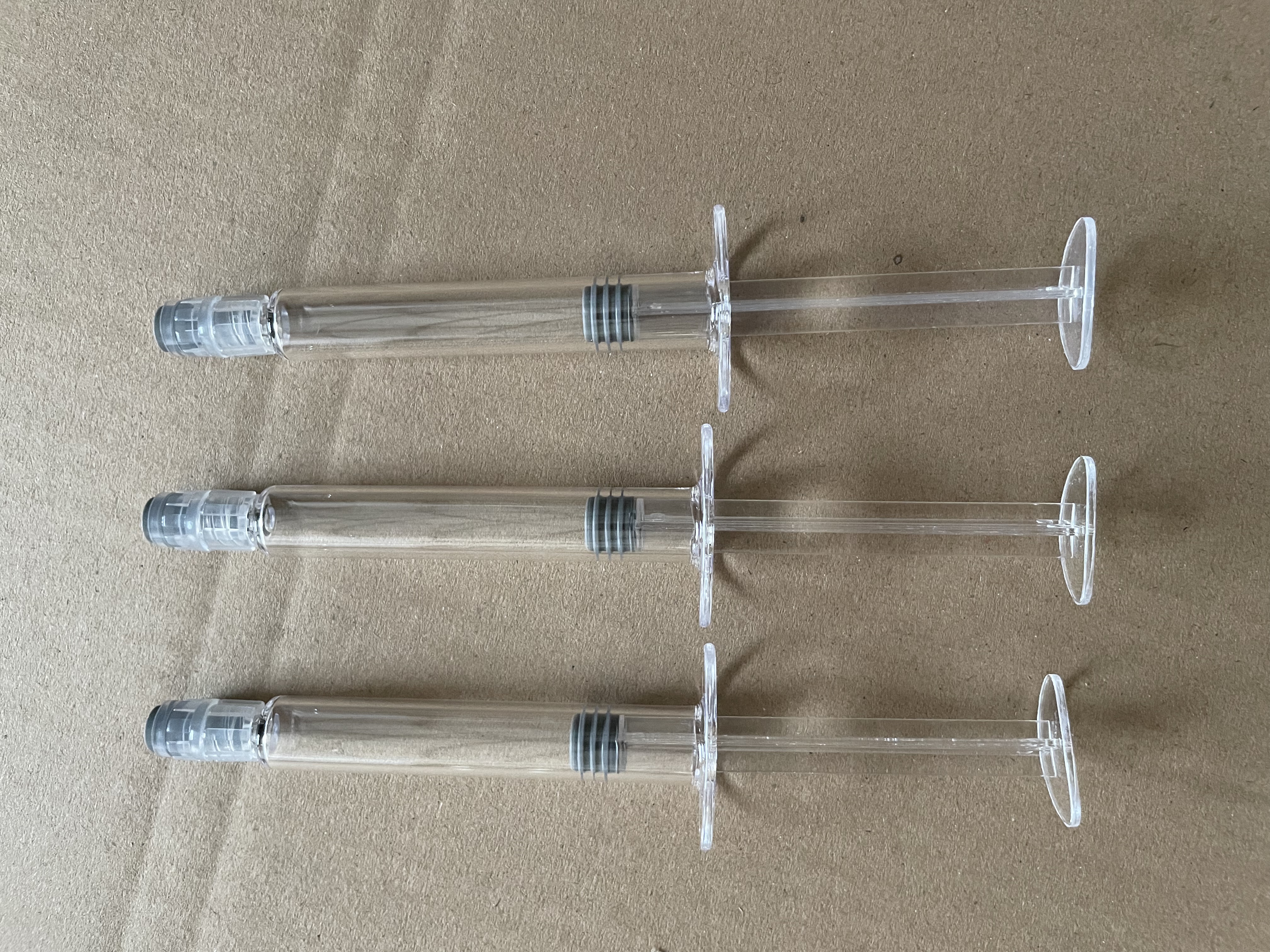 Tube transparent avec caoutchouc gris