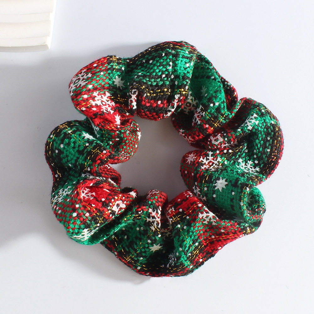 Edición navideña: copo de nieve rojo y verde.