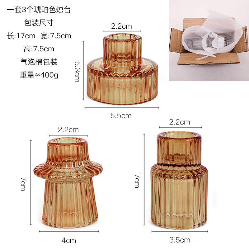 Ensemble de trois bougeoirs en verre ambré