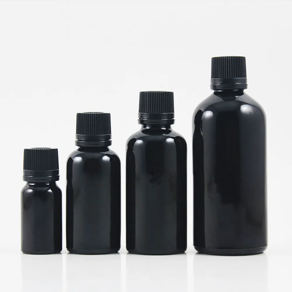 5ml 10ml 15ml 20ml 30ml 50ml 100ml Bouteilles en verre noir cosmétique avec différentes tailles d'huiles essentielles Vis Couvercles en plastique noir