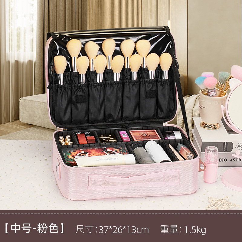 Valise trolley rose de taille moyenne avec bandoulière à 3 niveaux.