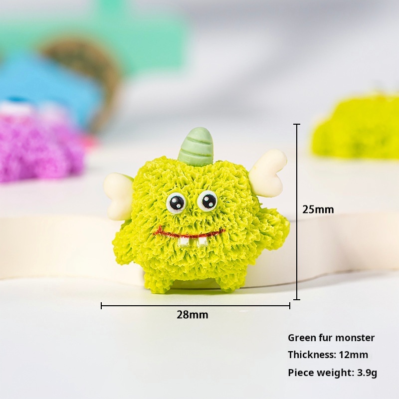 Monstruo de peluche verde.