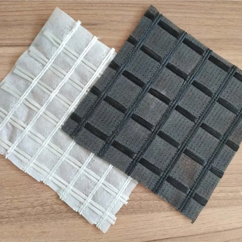 Biaxiaal Polyester Geogrid Composiet Niet-Geweven Bitumen Gecoat Voor Asfalt Bovenlaag Versterking Grind Raster