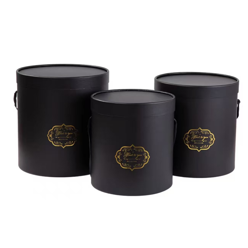Three black covered cases (one large, one medium and one small)