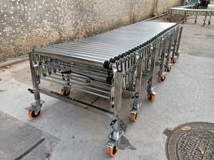 Transportador de rodillos de acero de alta calidad para carga y descarga de contenedores Neumático accionado por potencia para plantas de fabricación