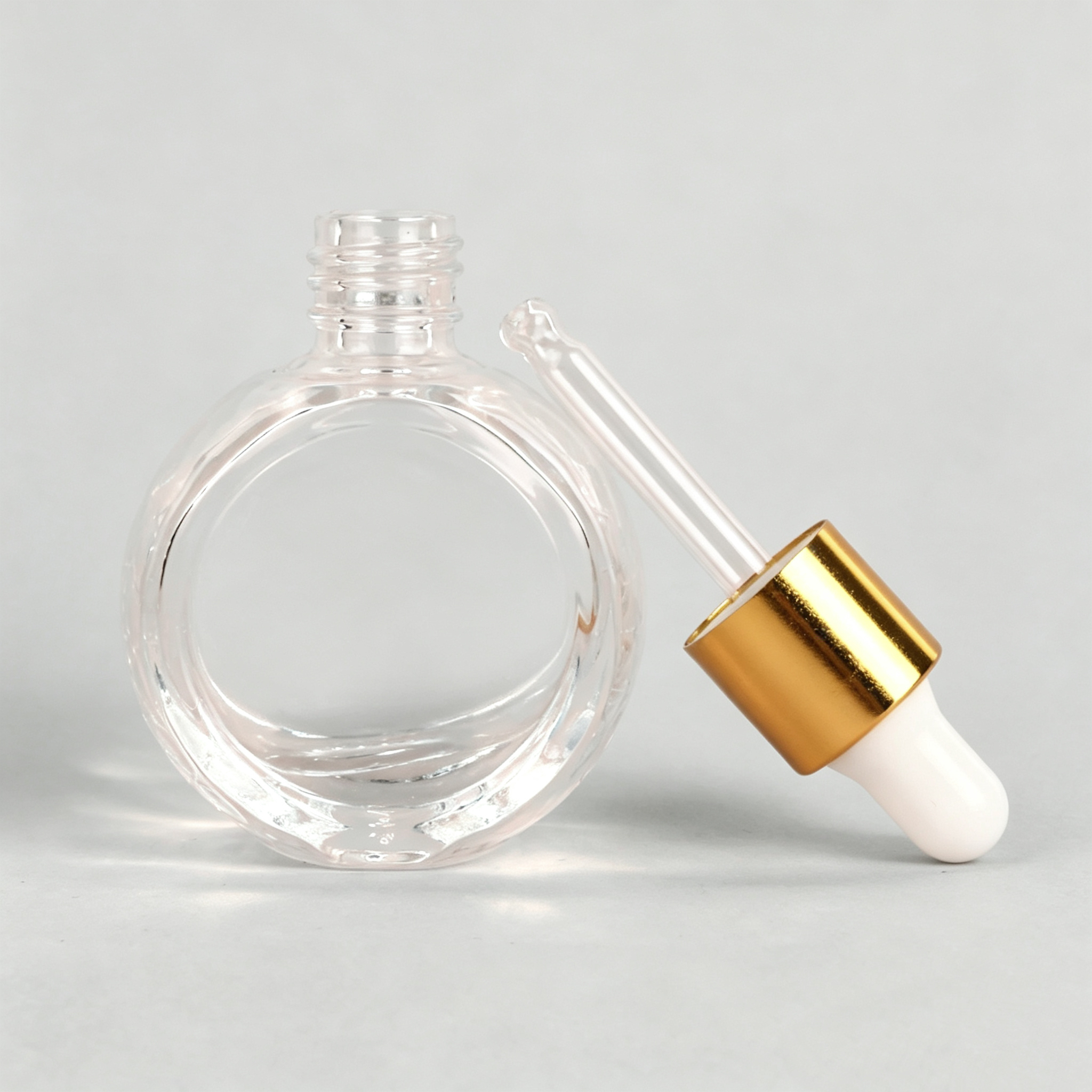 clear bottle + gold dropper