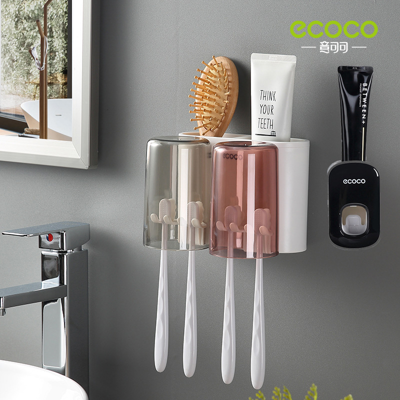 Two cups of toothpaste squeezer, black and white
