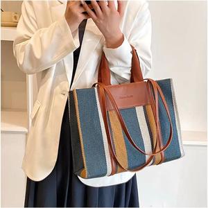 Qetesh Unisex büyük kapasiteli tuval omuzdan askili çanta kontrast çizgili fermuar kadın Trendy kore versiyonu Tote çanta sınır ötesi