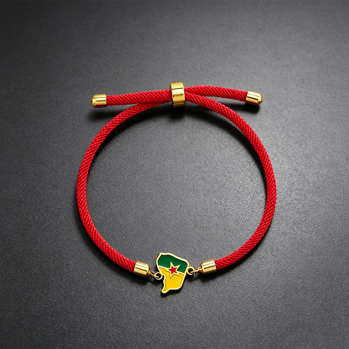 Pulsera roja de Guayana Francesa dorada.