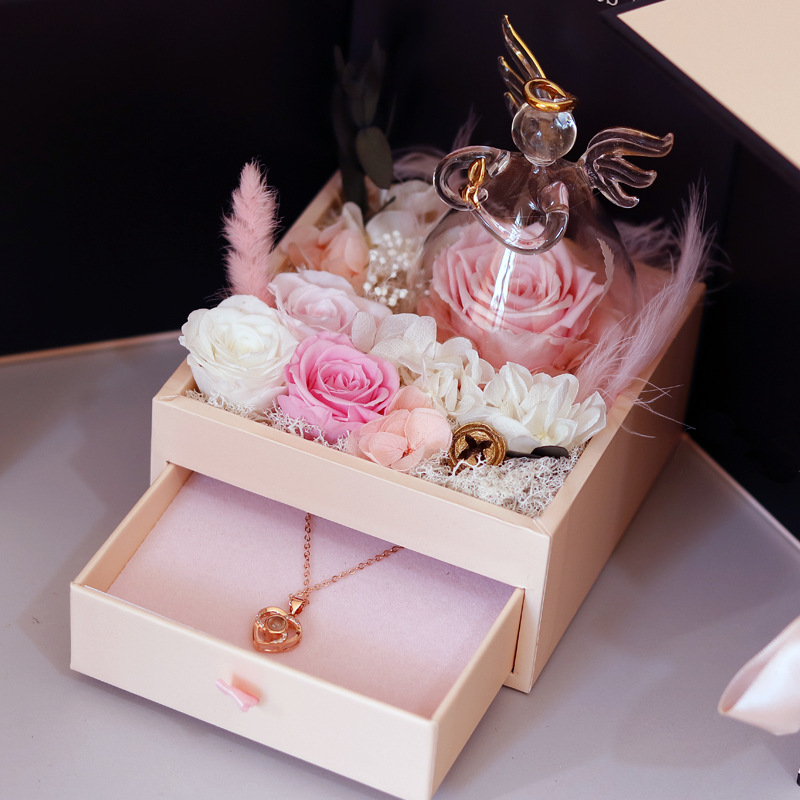 Rosa doble caja sorpresa abierta pequeño ángel rosa