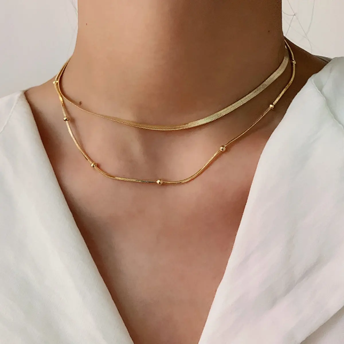 Venta al por mayor a granel chapado en oro collar de acero inoxidable cadena collar de doble capa joyería de moda para mujer