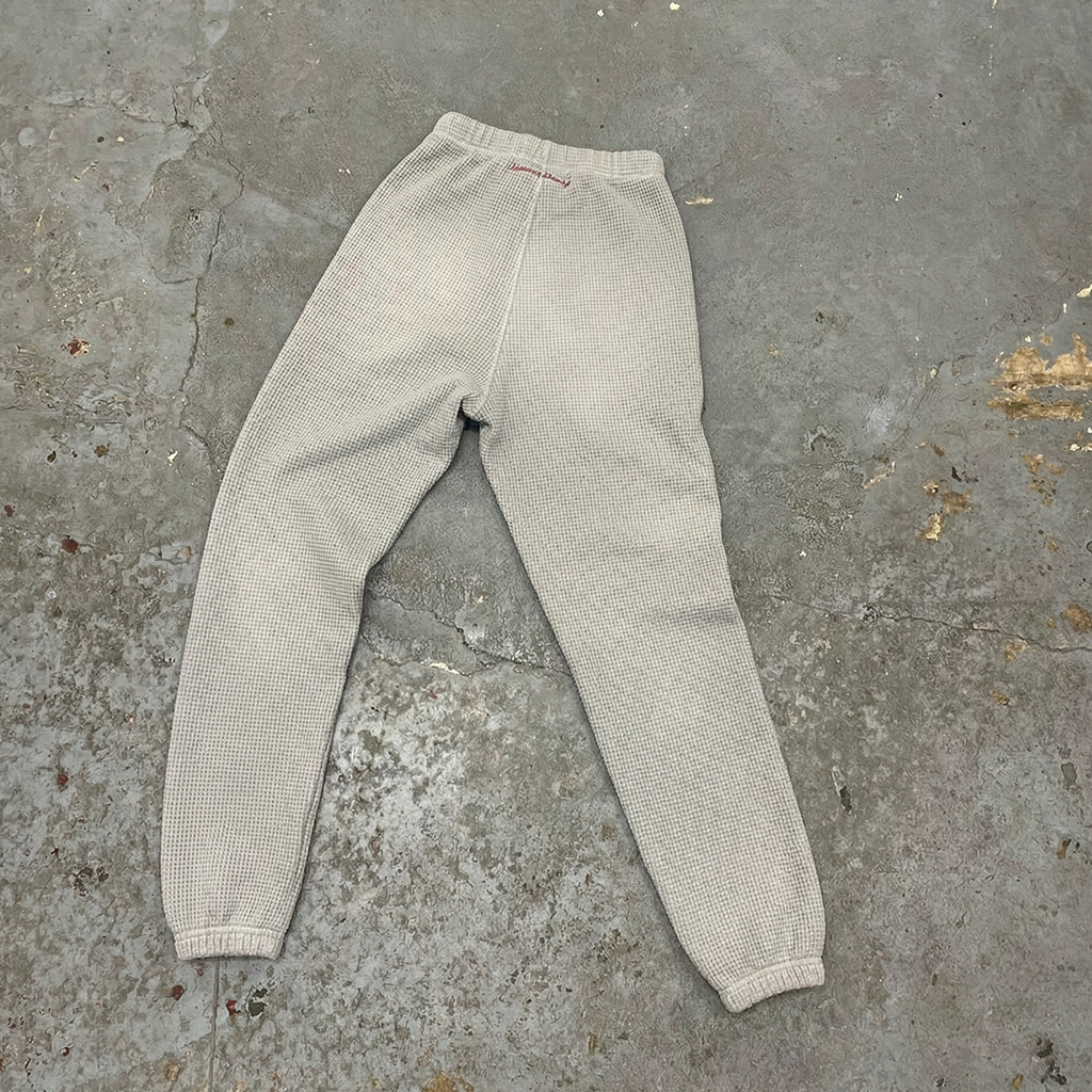 Pantalon gris à bandes aux chevilles