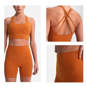 XW-2197 2025夏季批发弹性运动服不对称交叉肩带快干跑步俯卧撑运动瑜伽女式文胸