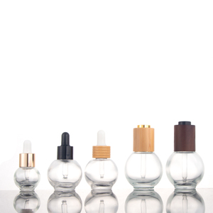 <strong>Empty</strong> Ball Shape Round clear Cosmetic Glass 30ml 50ml Essential Oil <strong>Bottles</strong> with <strong>Dropper</strong> Cap White Rubber Top with Cuticle Oil - Product Image 1