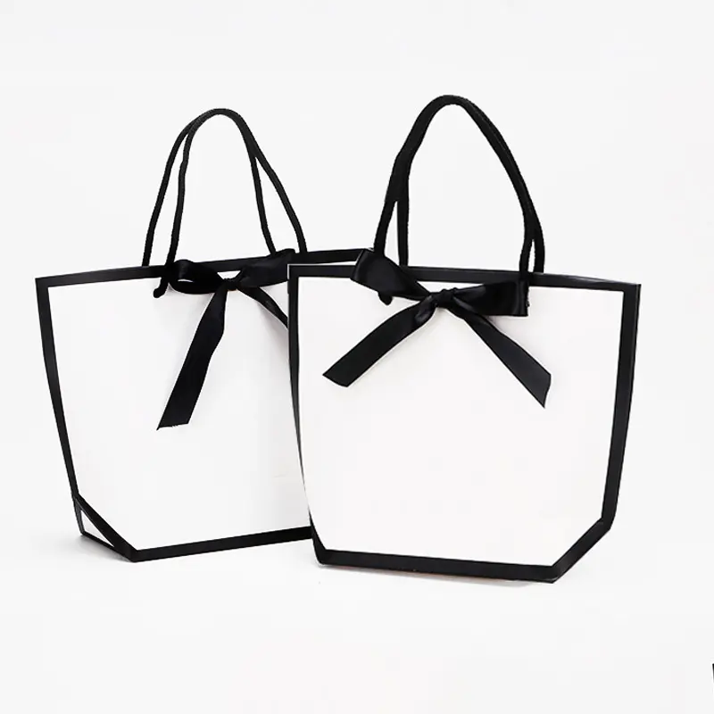 Giyim mağazası taşınabilir çanta şerit kağıt saplı çanta High-end alışveriş çantası In stokta takı