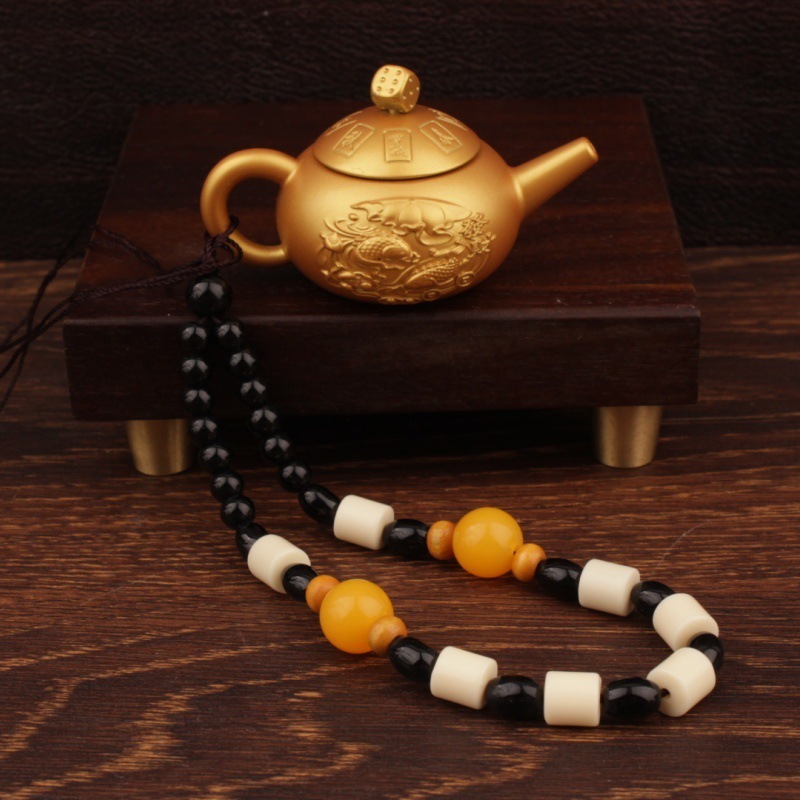 Tetera con mango de doble pez chapado en oro (con cuerda)