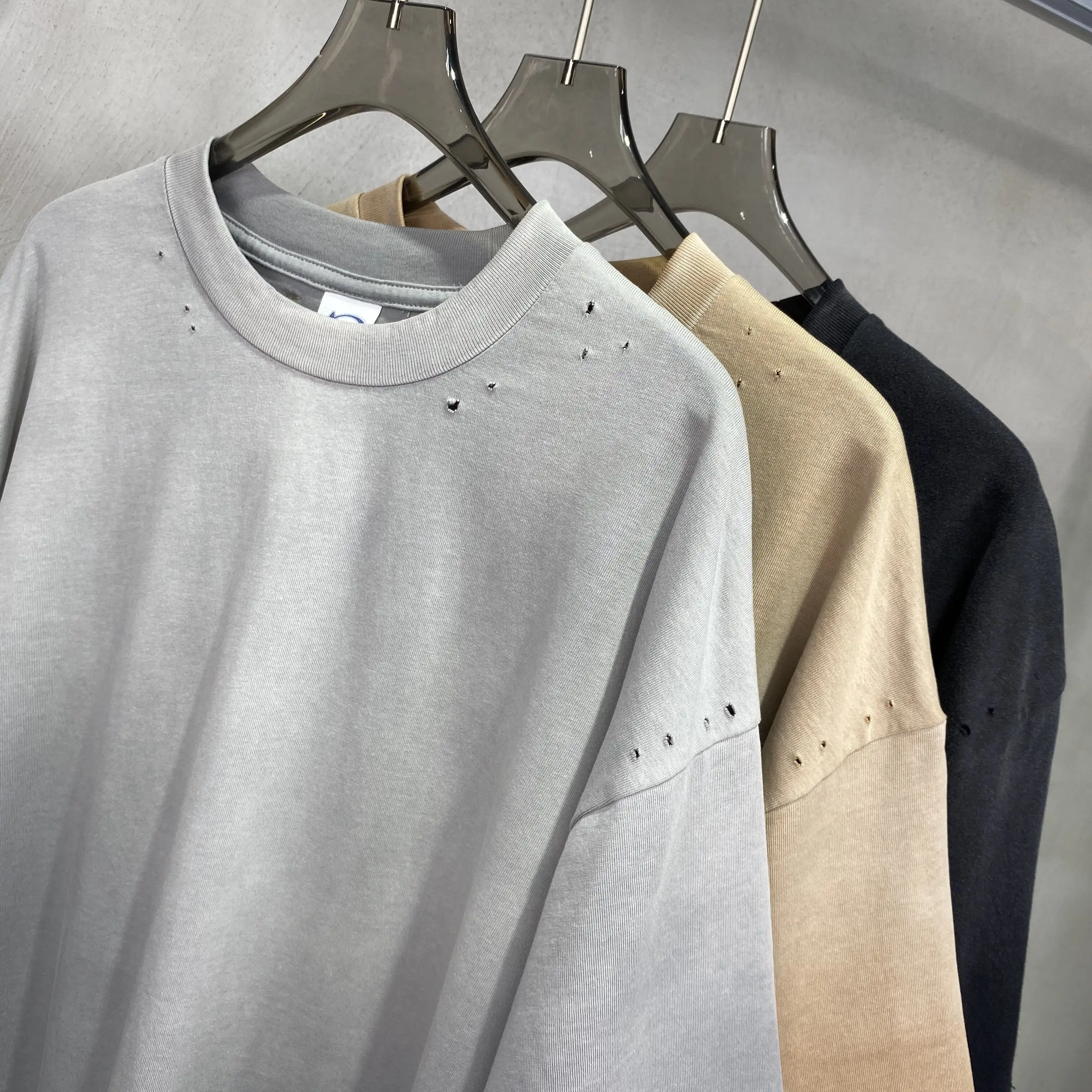 Nueva camiseta de forma suelta para hombre y mujer 100% algodón puro 250 GSM Wash Trend se puede personalizar OEM al por mayor talla grande corta