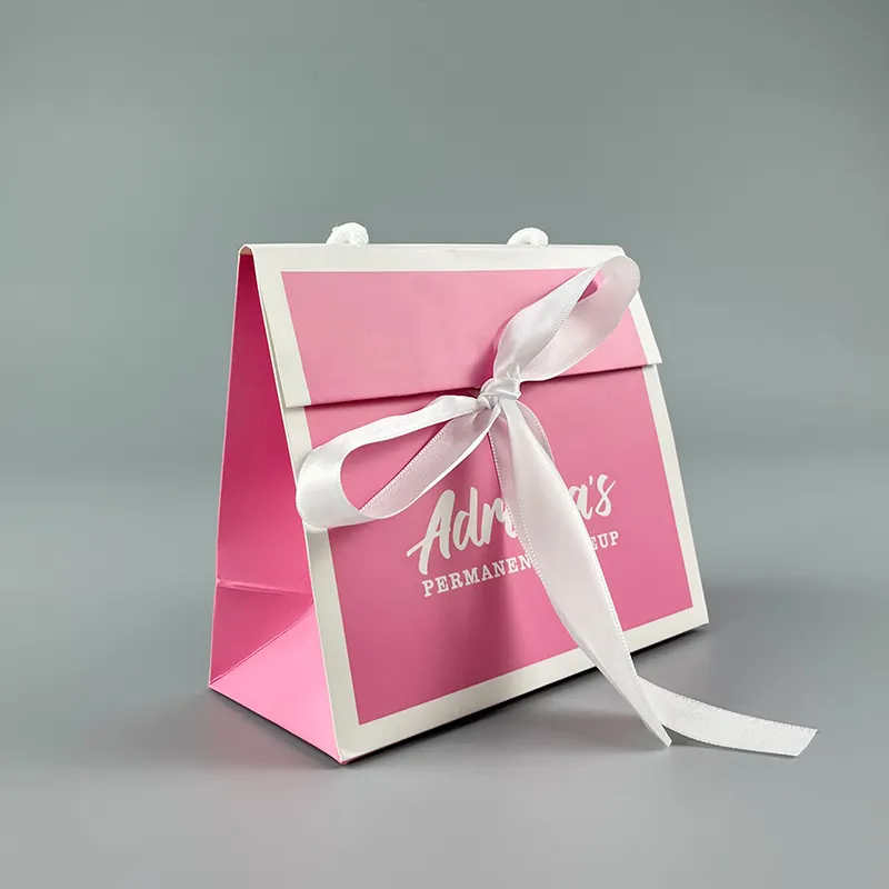 Tùy chỉnh màu hồng quà tặng Túi giấy với bông dây nơ ruy băng xử lý cho trang điểm mua sắm mỹ phẩm